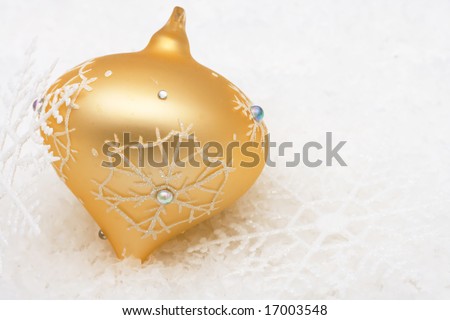 Gold glass Christmas decorations on snow background, Christmas decoration
