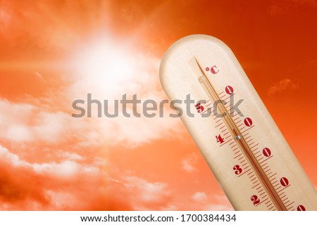Weather thermometer with high temperature and beautiful sky toned in red on background, space for text 