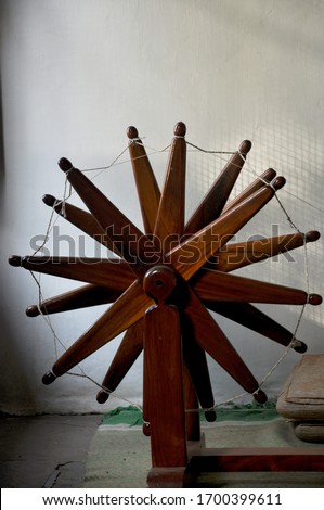 Mahatma Gandhi's charkha with which he used to make cloths called khadi Royalty-Free Stock Photo #1700399611