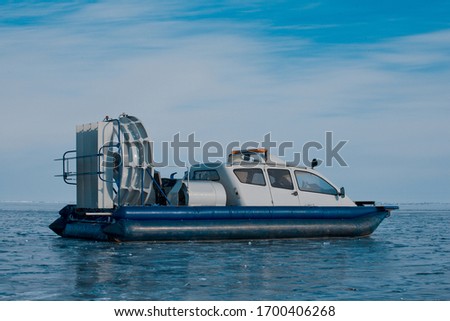 Sports hovercraft on the ice of lake Baikal, side view