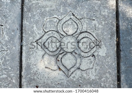 close up of vintage concrete lotus flower brick floor