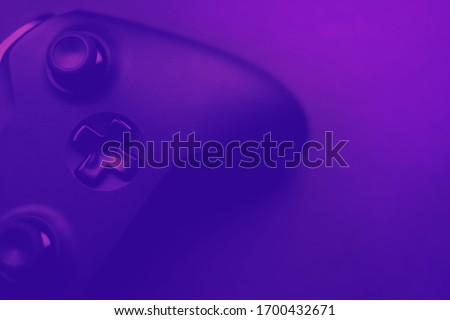 video games, esport violet blurred background with gamepad