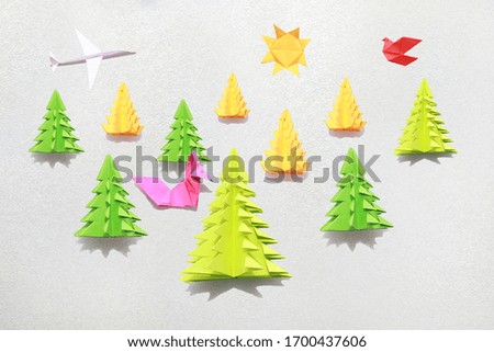 Craft of paper trees, fox, bird and airplane.