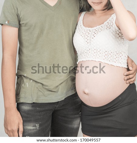 Husband hugging pregnant 