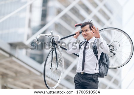 hipster man riding bicycle in downtown