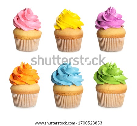 Set of delicious birthday cupcakes on white background
