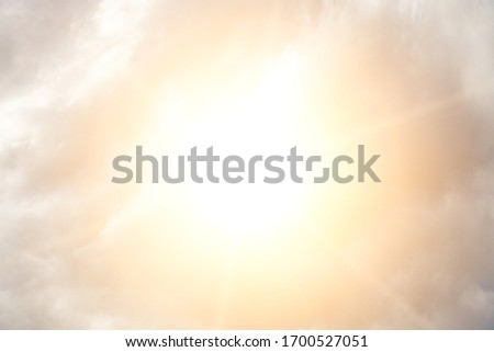Sky with clouds and bright sun