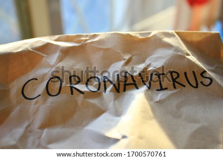 CORONAVIRUS text on twisted paper,is handwritten on the paper,Coronavirus danger and public health risk disease and flu outbreak.