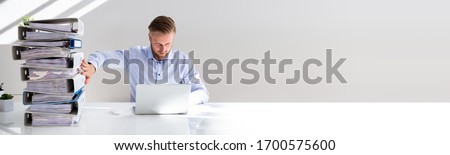 Calculating Invoice Document Using Accounting Software. Digital Transformation Concept Royalty-Free Stock Photo #1700575600