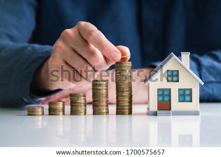 Property Taxes And Real Estate Market Growth Royalty-Free Stock Photo #1700575657
