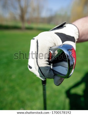 Golf player holding a golf club in golf course. A perfect day. This sport for vacation recreation. Concept  