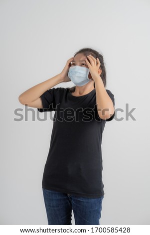 Close up portrait of young woman with medicine health care mask against white white background. CoronaVirus, Covid-19. Asian people