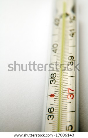 detail photo of medical thermometer on white background, distance blur