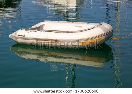 Inflatable boat on the water for saving people, for fishing, judge's boat. The concept of safety on the water, fishing.