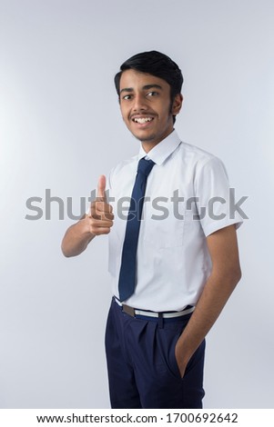 Young indian man showing thump up