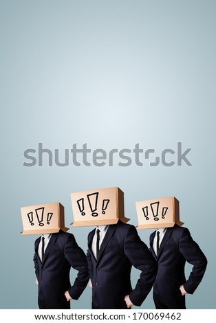 Group of men gesturing with exclamation marks drawn on box on their head