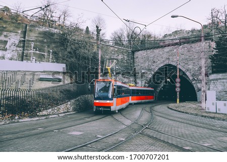 Modern tramway in Bratislava city center. Entering the old tunnel. 