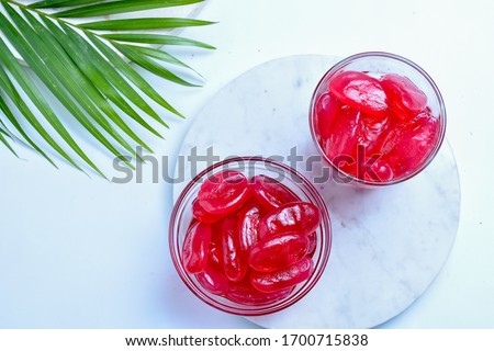 manisan kolang kaling ,preserved sugar palm fruit,tinted red with red syrup and paste  .an indonesian typical refreshment and dessert during ramadan month and hari raya idul fitri.bright mood