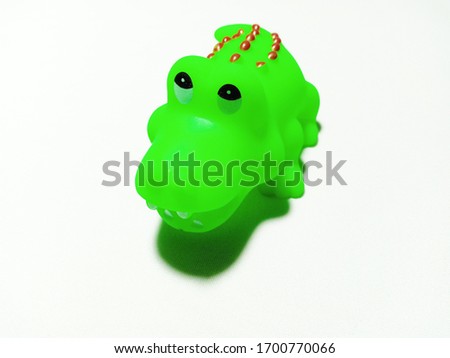 Plastic crocodile toy, isolated on a white background