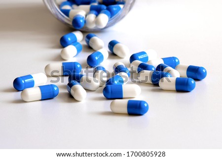 Pharmacy drugs that enhance the work of the body's immune system. Medicine capsules are on the table in close-up