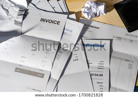 Invoice is crumpled on the table