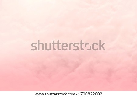 Pink sky background and white clouds background. The sky before a large storm. Pink background and Sweet dream.