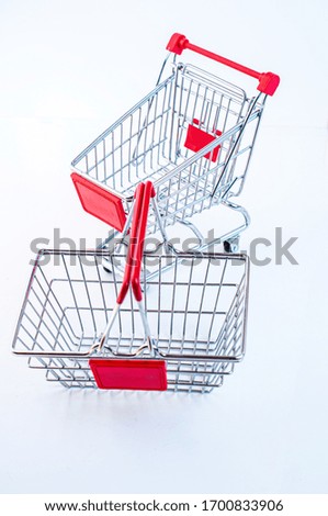 hypermarket trolleys and basket on a white background