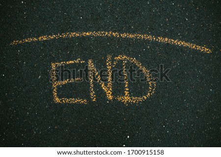 End sign on the road.