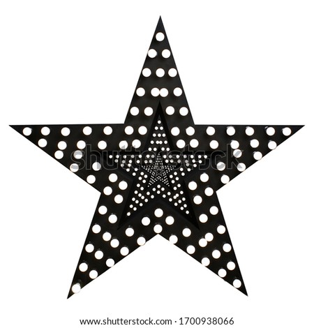 Photo an isolated decorative star with lamps, a huge star with a garland, a black star studded with burning bulbs, a decorative luminous star, the light is on.Decor Studio