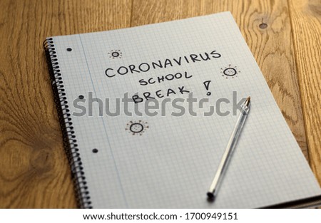 coronavirus school break sign on notebook