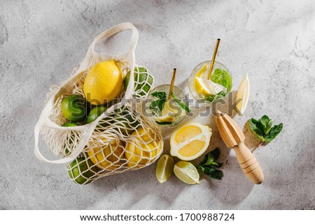 Fresh citrus lemonade with limes, lemons and mint. Summer drinks.  
