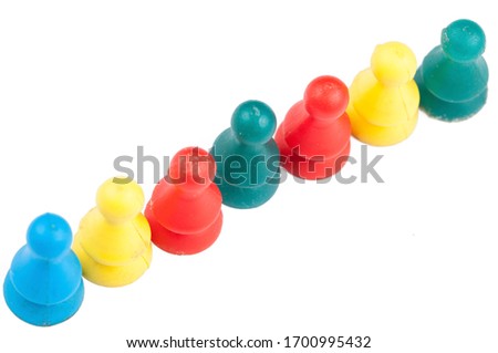 Colorful play figures with dice isolated on white background.Copy space