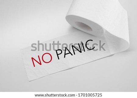 rolled toilet paper on white background with inscription No panic