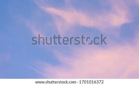 pink pastel clouds at sunset blue sky. abstract photo, background image