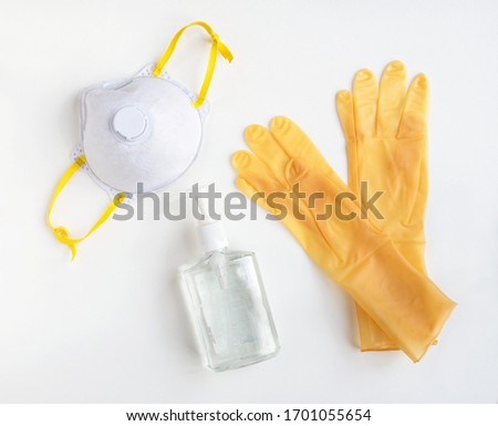 Yellow Personal Protective Equipment with NIOSH 95 Mask  Royalty-Free Stock Photo #1701055654