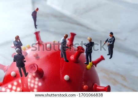 Businessmen ignore social distancing while standing in the presence of the deadly coronavirus Royalty-Free Stock Photo #1701066838