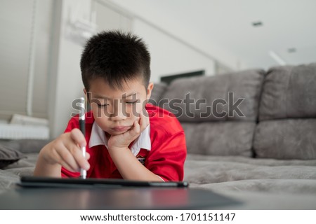 kid is addicted to tablet, boy playing smartphone, kid use telephone, watching cartoon
