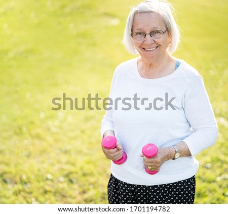 Senior woman doing sport and working out outdoors