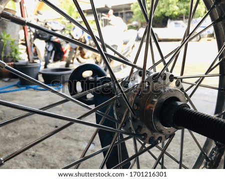 Close-up of the motorcycle wheel hub at the center