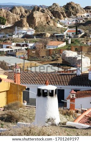 on the street of old town of Guadix Spain with cave houses