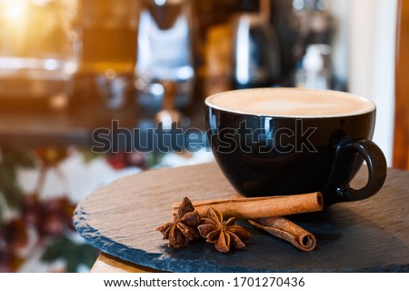 Closeup tray with serving aromatic cup of coffee with cinnamon. Barista prepared, brewed espresso, americano, latte, cappuccino using professional machine in cafe, restaurant. Hot drinks concept.