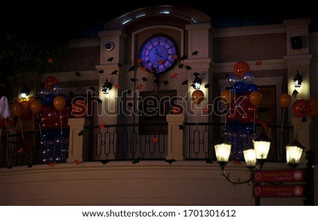 Halloween decoration on clock tower in spooky theme