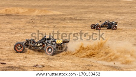 RC buggy in the desert, summer day Royalty-Free Stock Photo #170130452