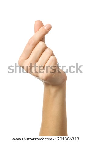 Finger heart. Woman hand with french manicure gesturing isolated on white background. Part of series Royalty-Free Stock Photo #1701306313