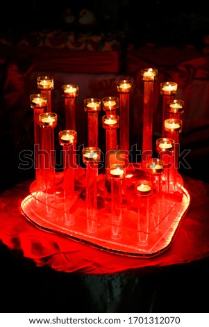 Red heart with little burning candles