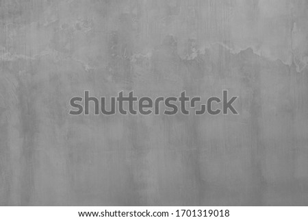 Photo of outdoors textured from empty old flat colorless matte cement wall background. 