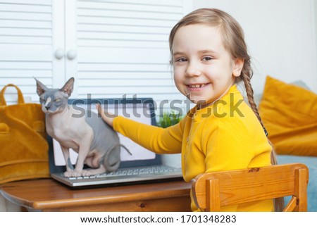 Child girl at home. Distance learning and on-line education concept