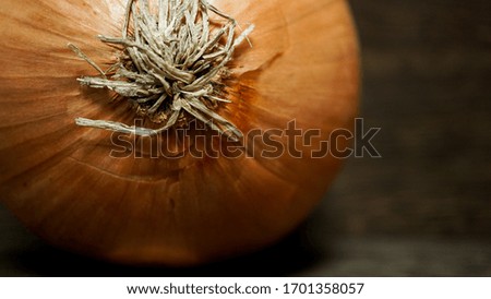 Take a picture of an unpeeled onion
