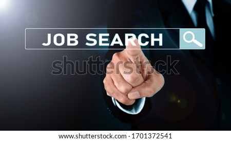 Man standing and pointing hand with 2020 Visual Graphic on Light and star background. COPY SPACE. Business Concept : JOB SEARCH.