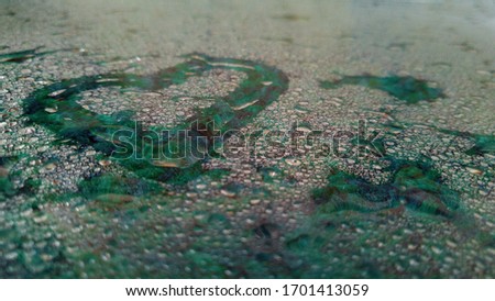 a green heart drawn with your finger on a wet glass surface in a beautiful creative photo